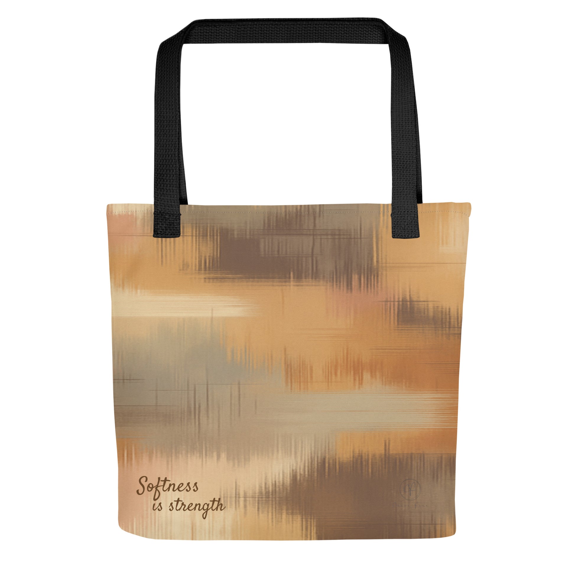 Beige and brown patterned tote bag with black handles and the phrase “Softness is strength” printed on the bottom right.
