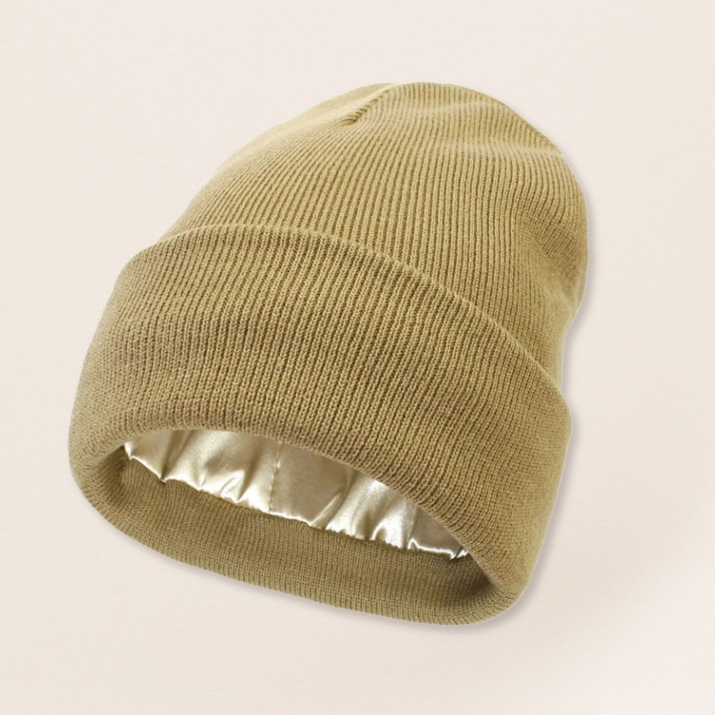 Beige beanie with satin interior on a beige background