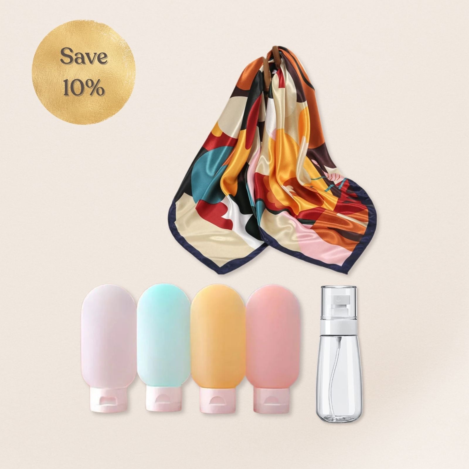 Colorful scarf with a pattern, five small bottles, and a clear spray bottle on a beige background.