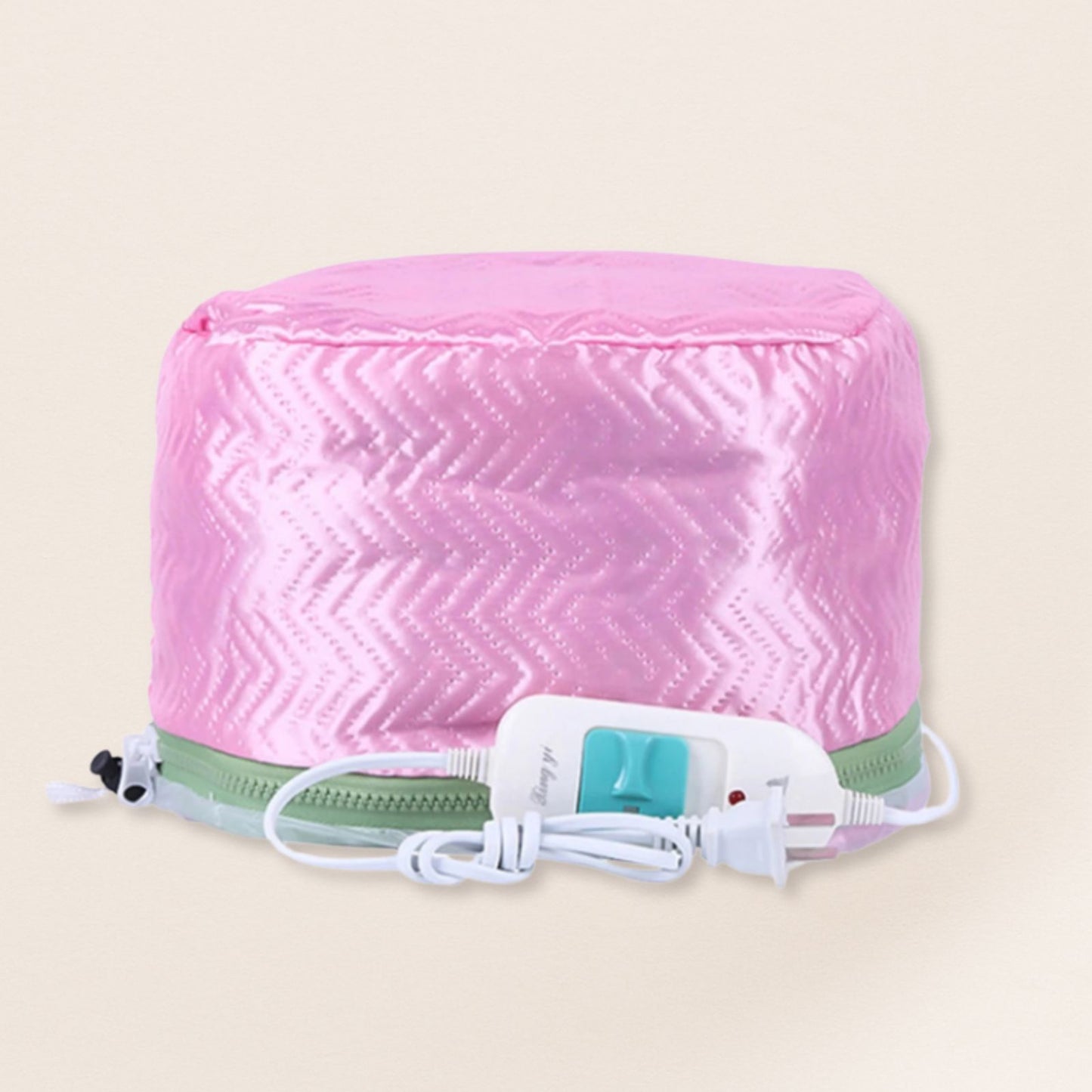 Pink heating pad with a white cord on a beige background