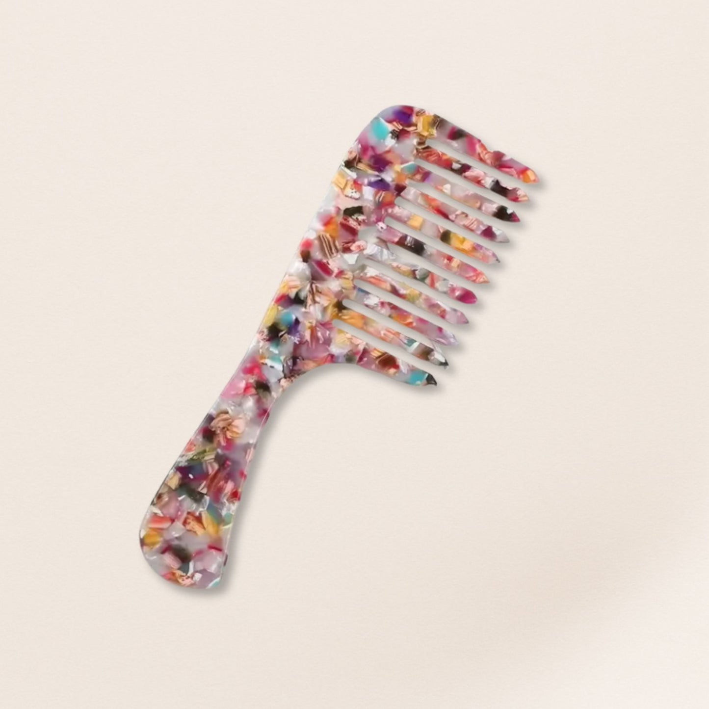 marbled wide-tooth combs for gentle detangling, displayed on a beige background.