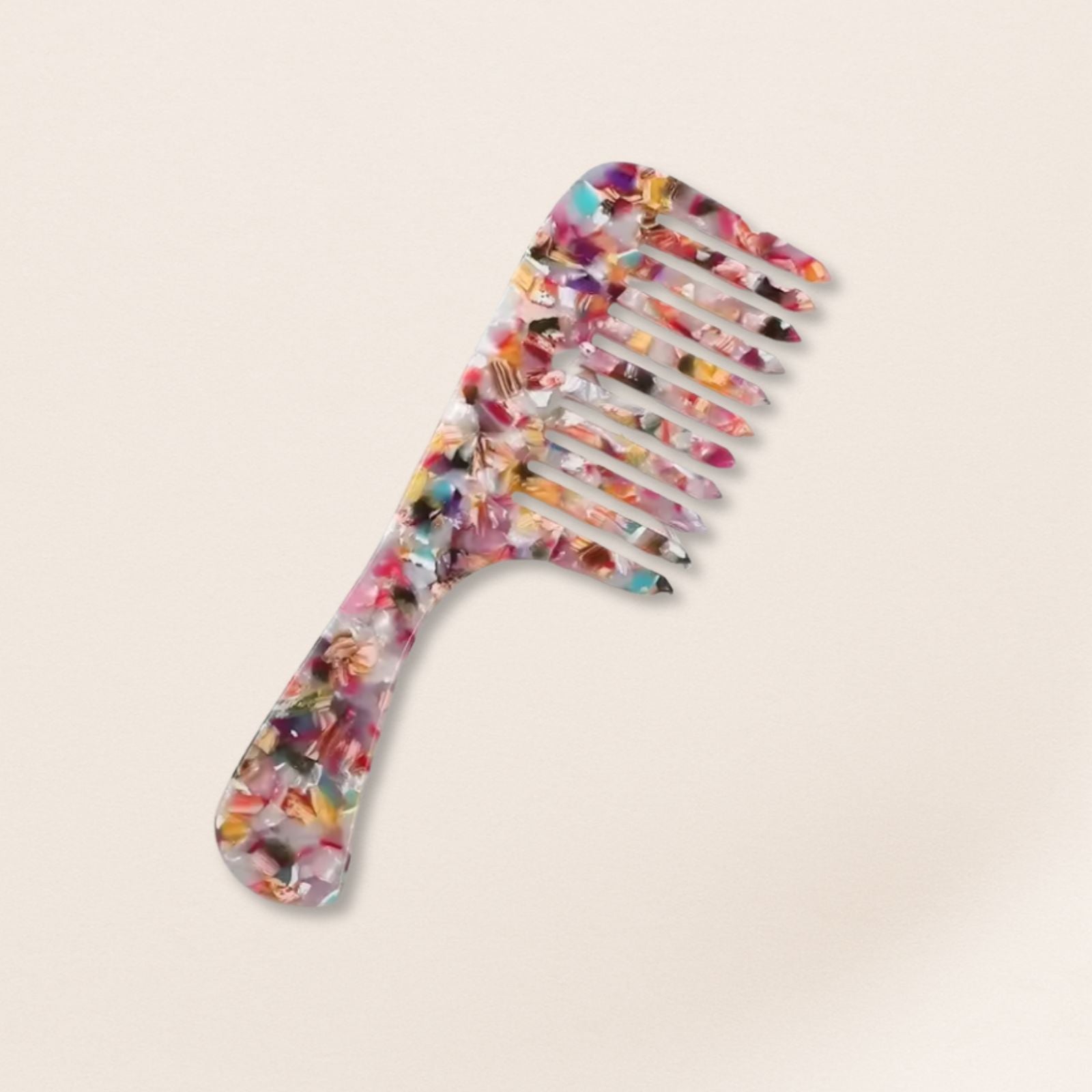 marbled wide-tooth combs for gentle detangling, displayed on a beige background.