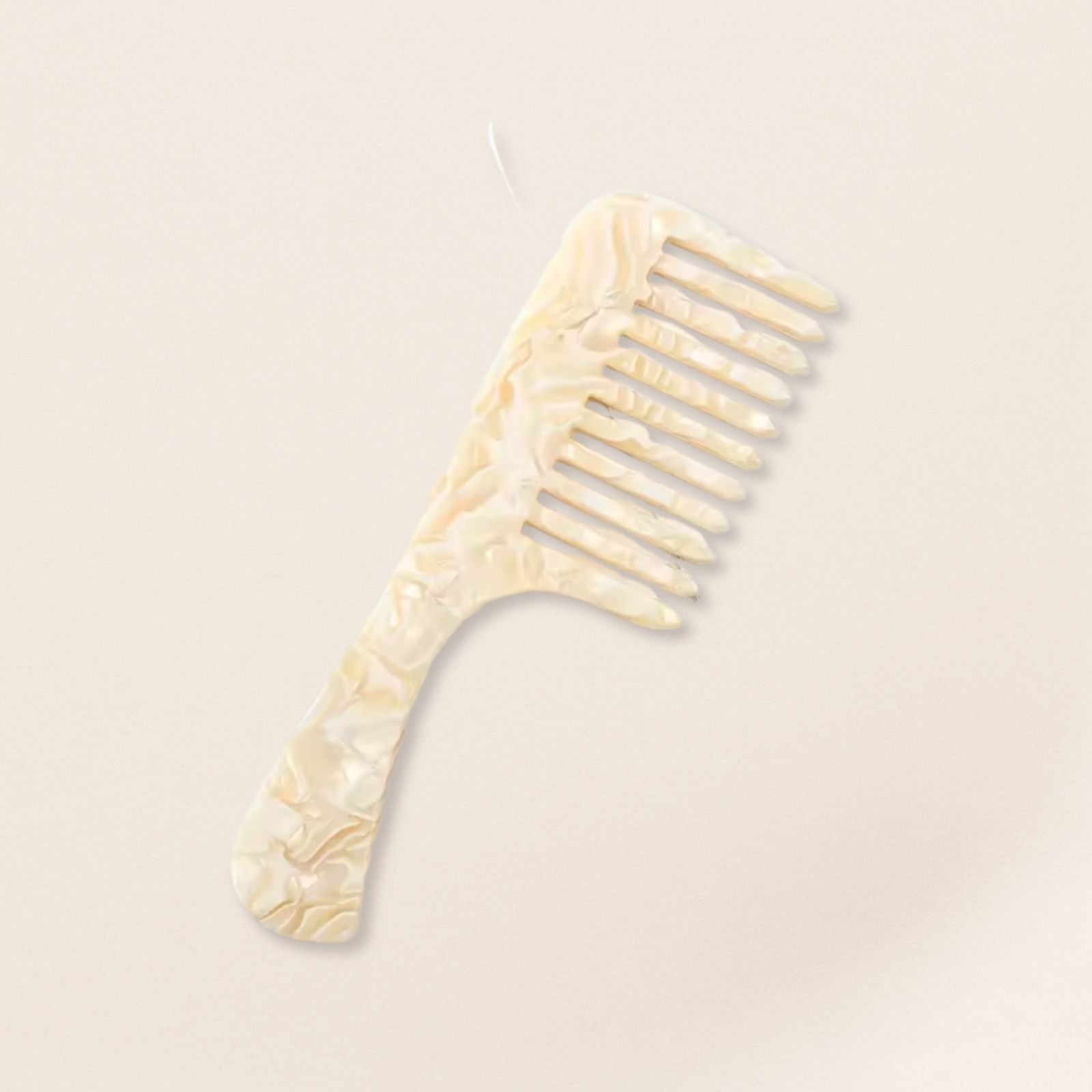 marbled wide-tooth combs for gentle detangling, displayed on a beige background.