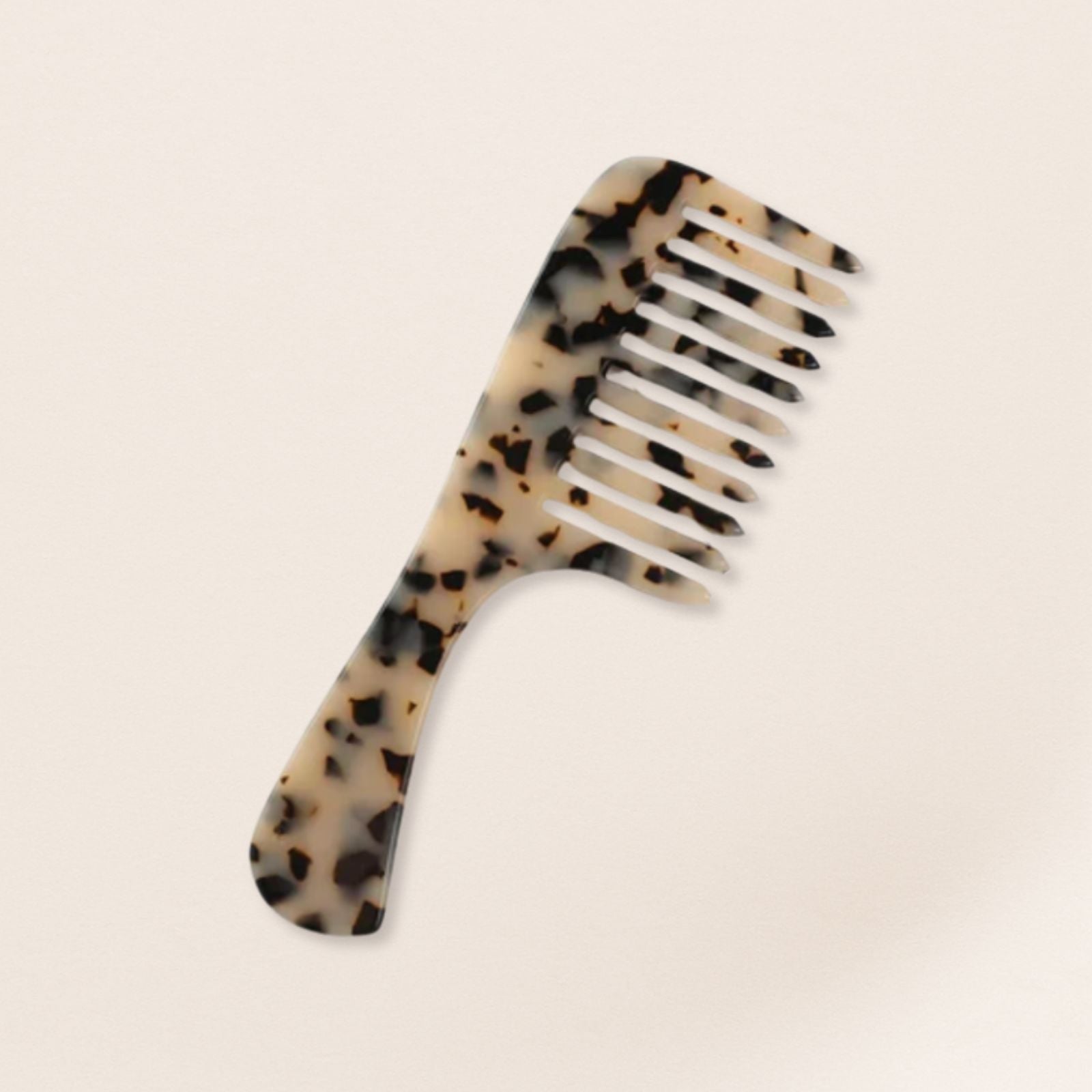 marbled wide-tooth combs for gentle detangling, displayed on a beige background.