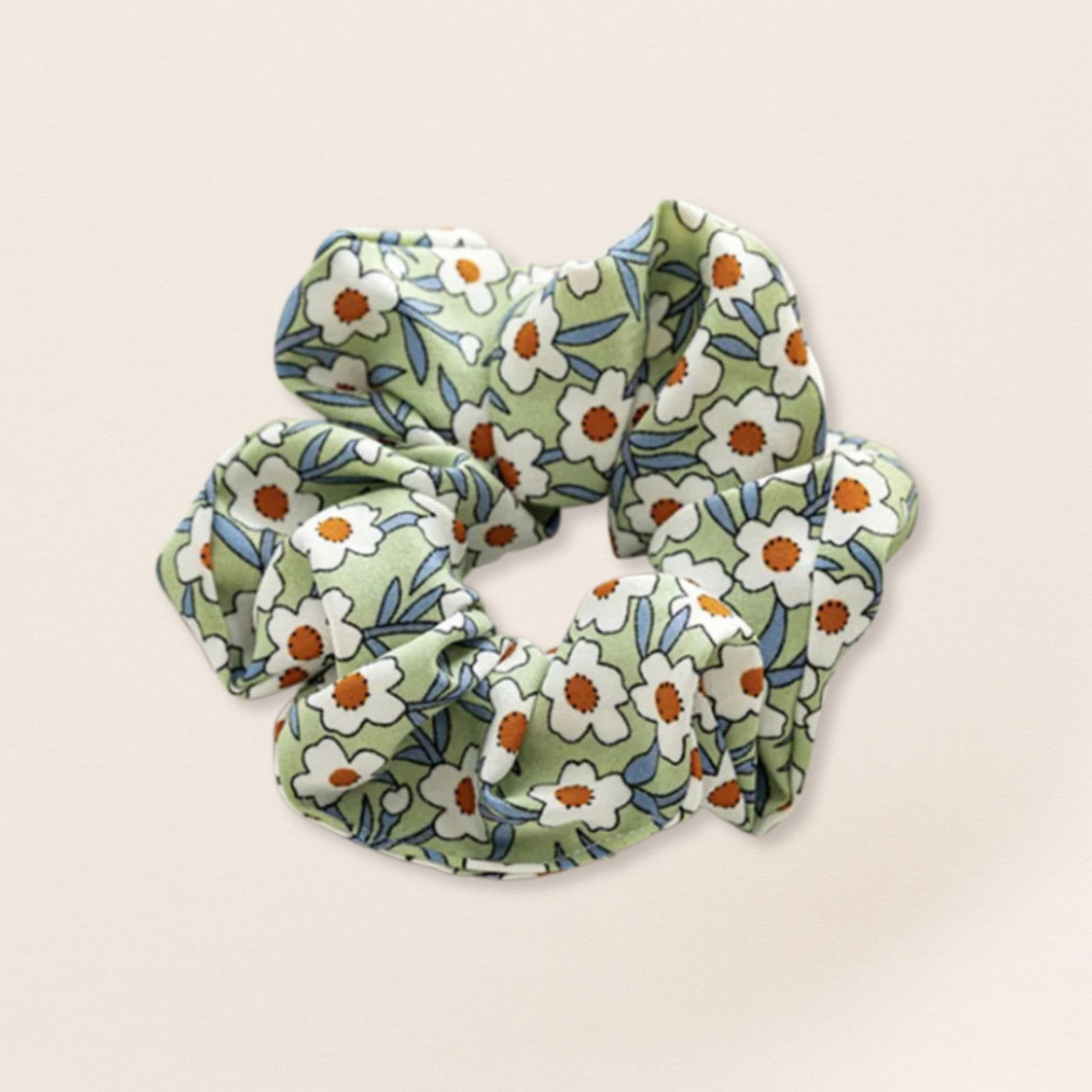Floral patterned scrunchie for fine hair on a beige background