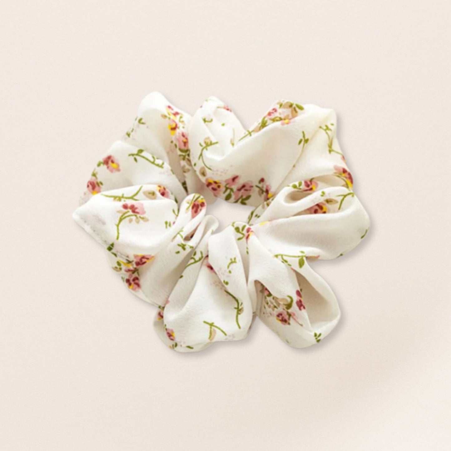 Floral patterned scrunchie for fine hair on a beige background