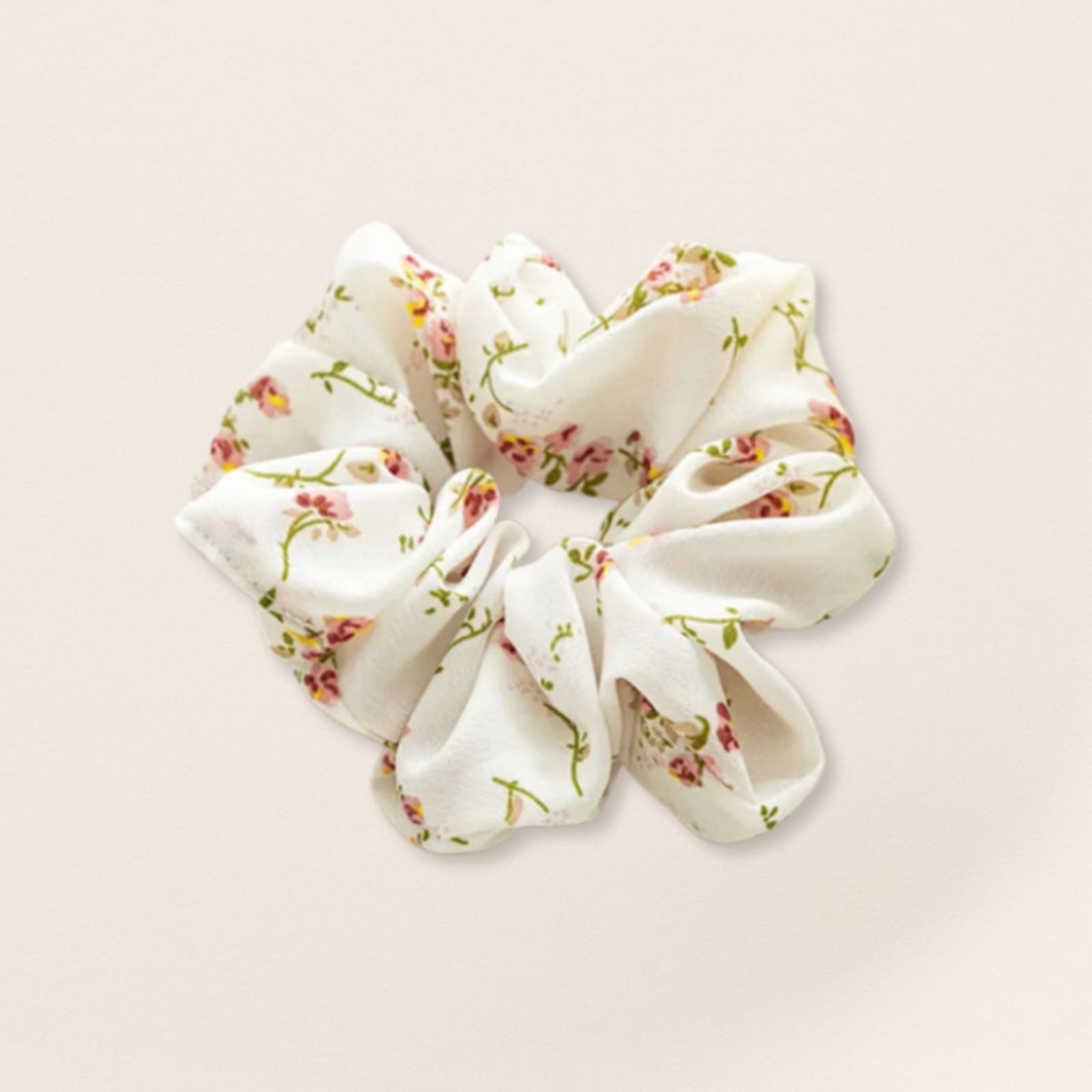 Floral patterned scrunchie for fine hair on a beige background