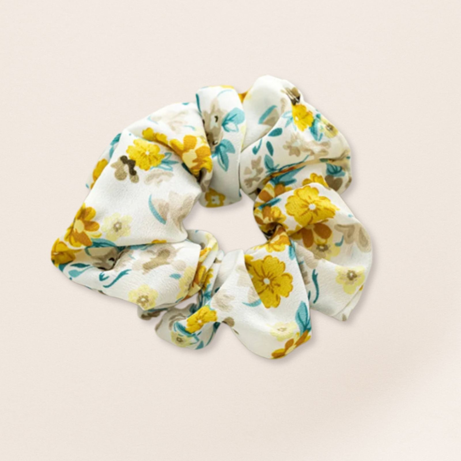 Floral patterned scrunchie for fine hair on a beige background