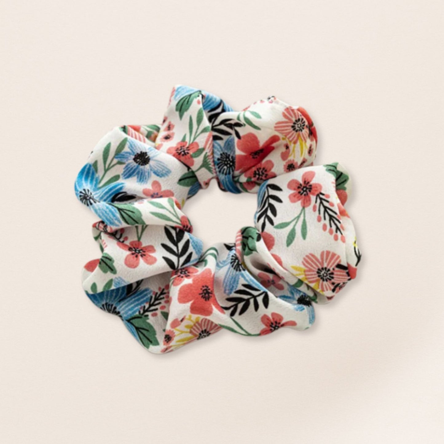 Floral patterned scrunchie for fine hair on a beige background