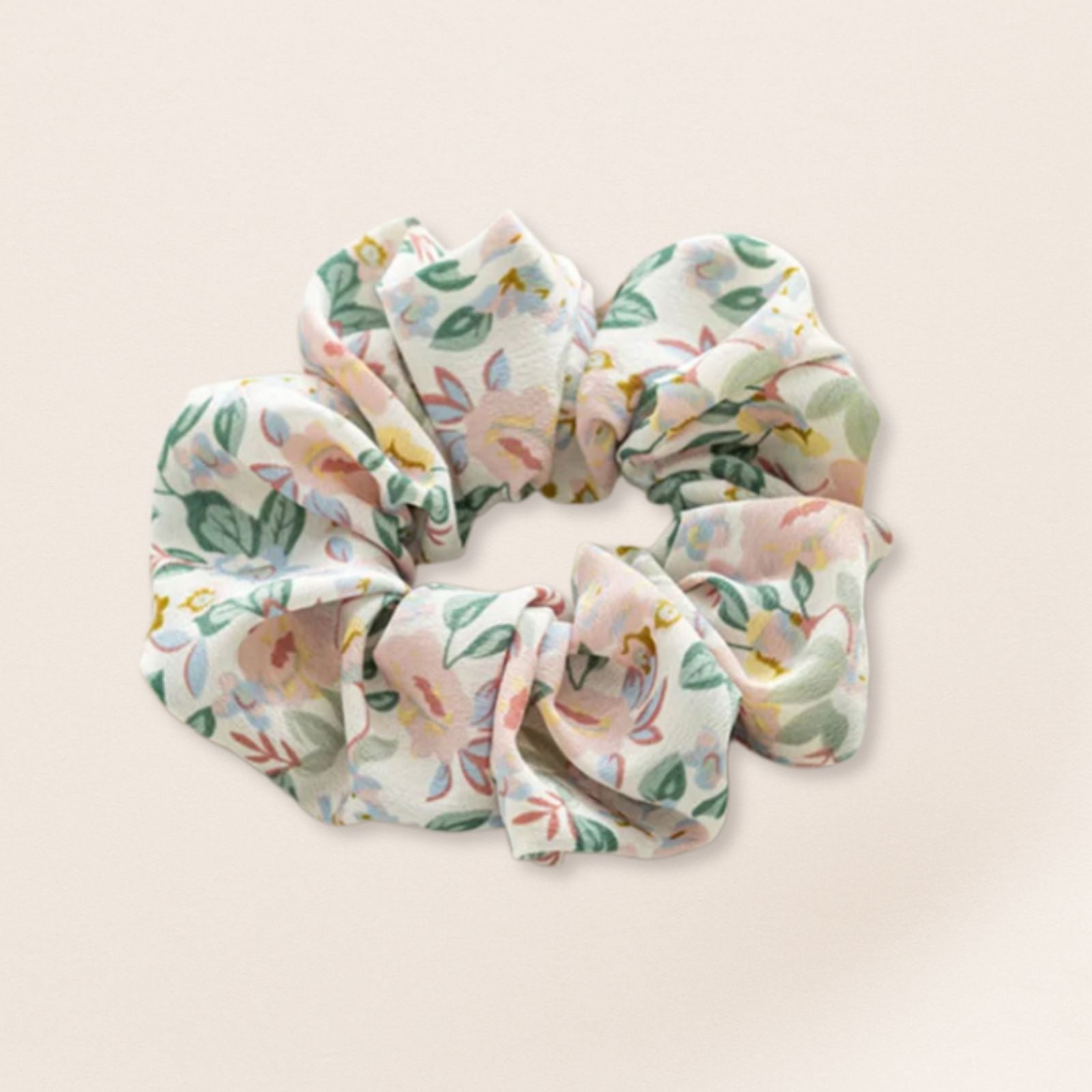 Floral patterned scrunchie for fine hair on a beige background