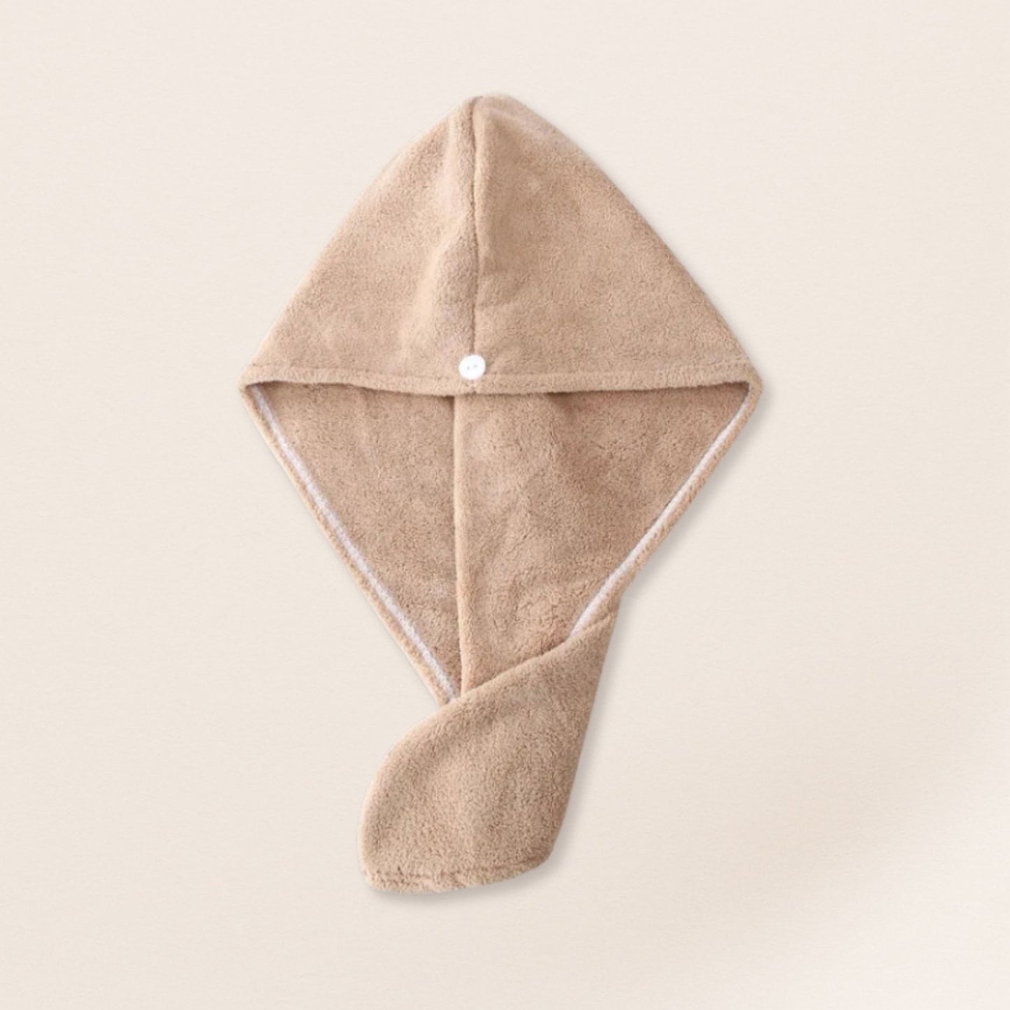 Beige microfiber towel for fine hair on a beige background