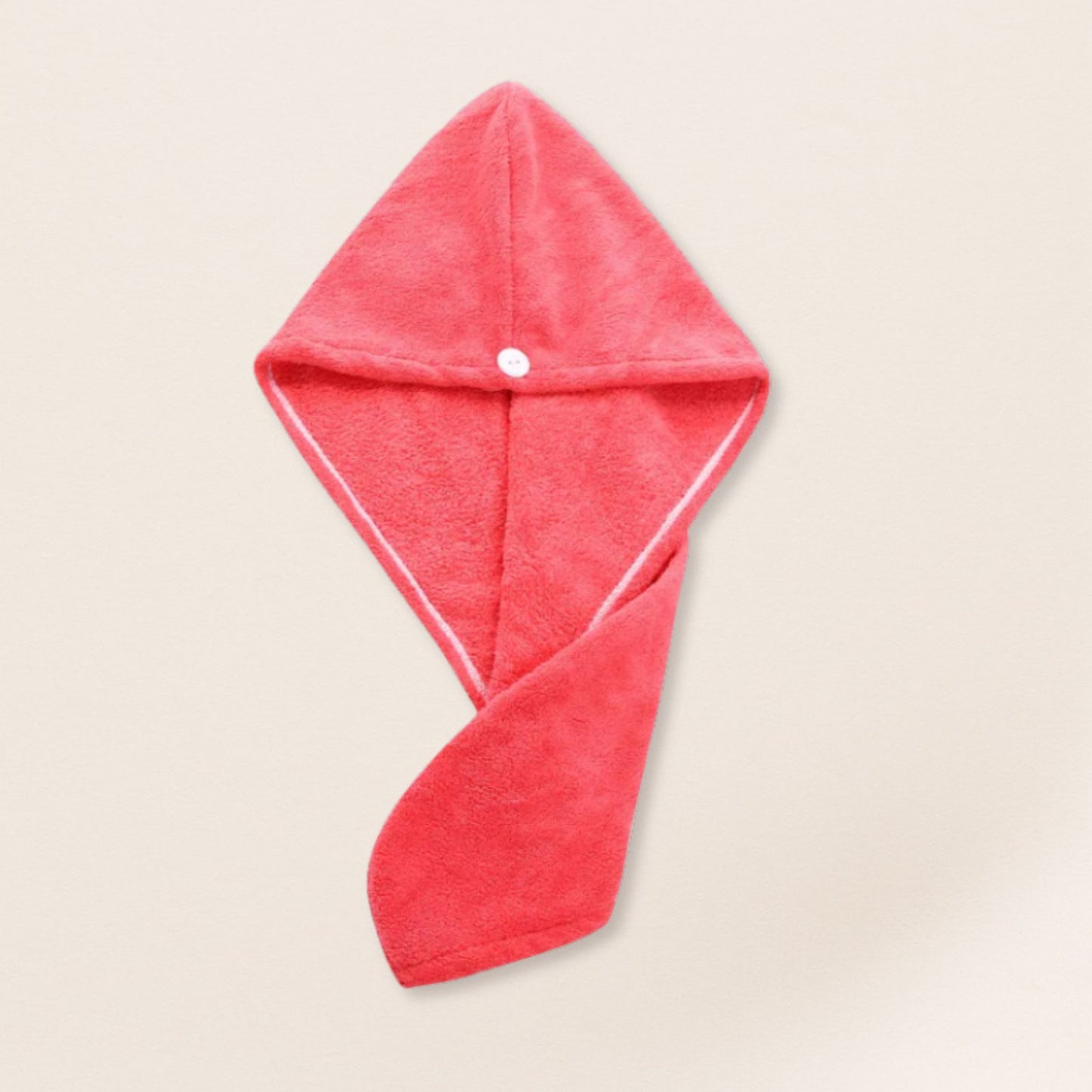 Red microfiber towel for fine hair on a beige background