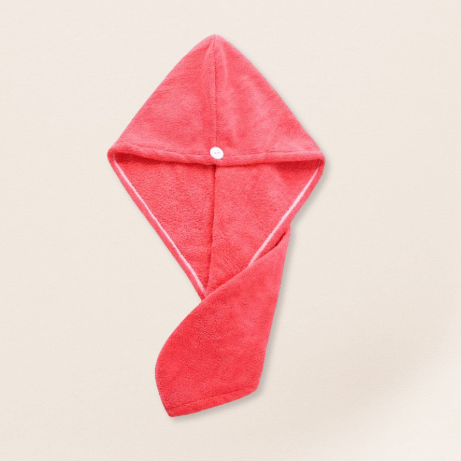 Red microfiber towel for fine hair on a beige background