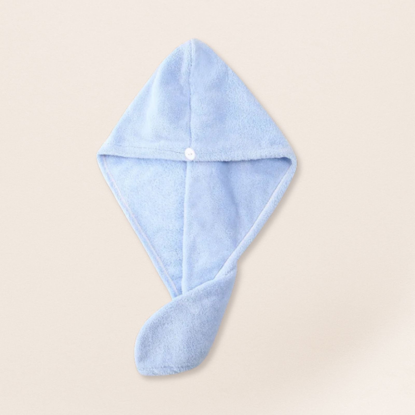Blue microfiber towel for fine hair on a beige background