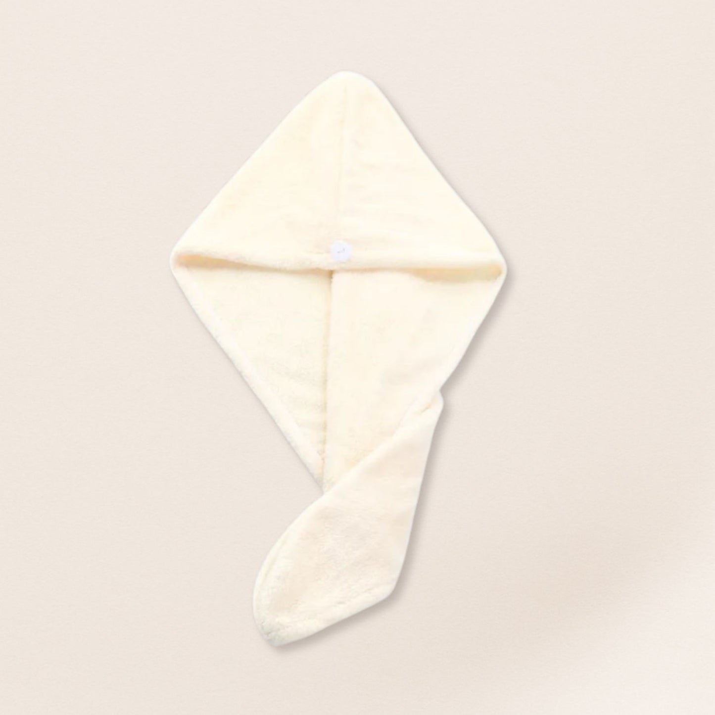 White microfiber towel for fine hair on a beige background