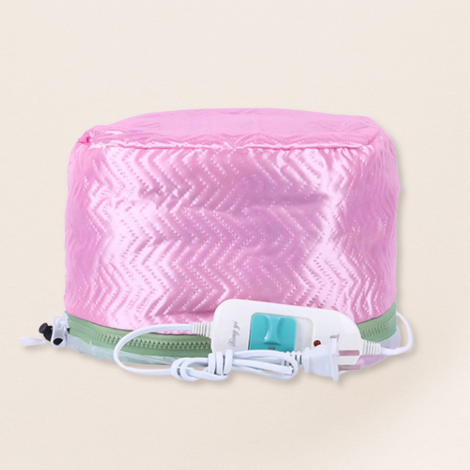 Pink heating pad with a white cord on a beige background