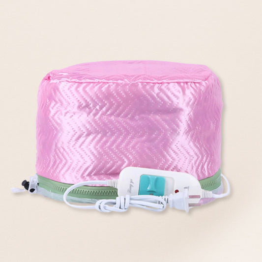 Pink heating pad with a white cord on a beige background