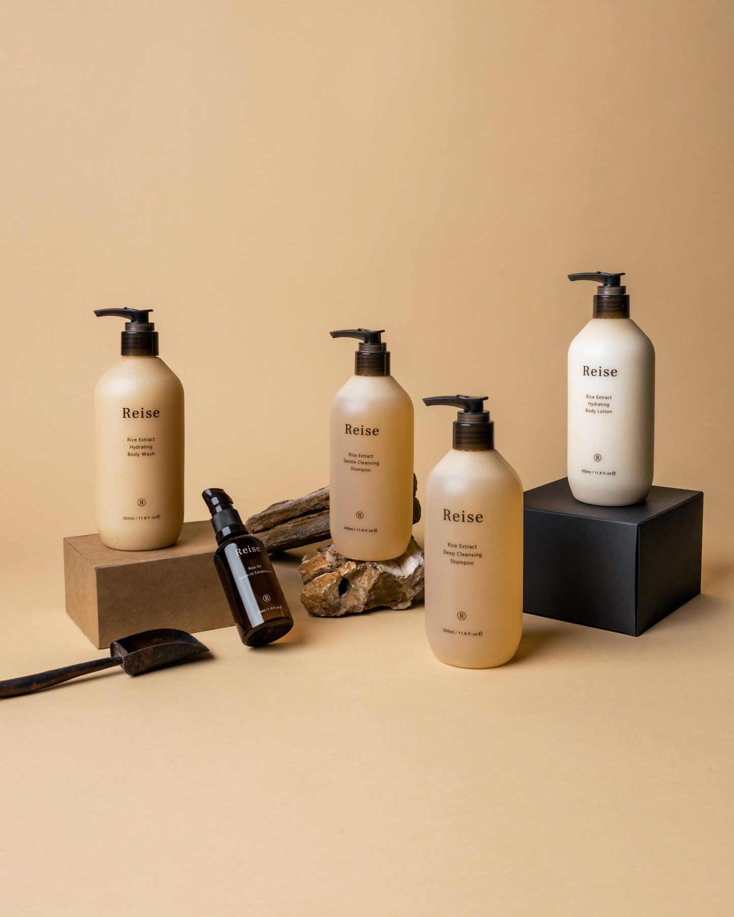 Set of Reise Haircare products for fine hair on a beige background