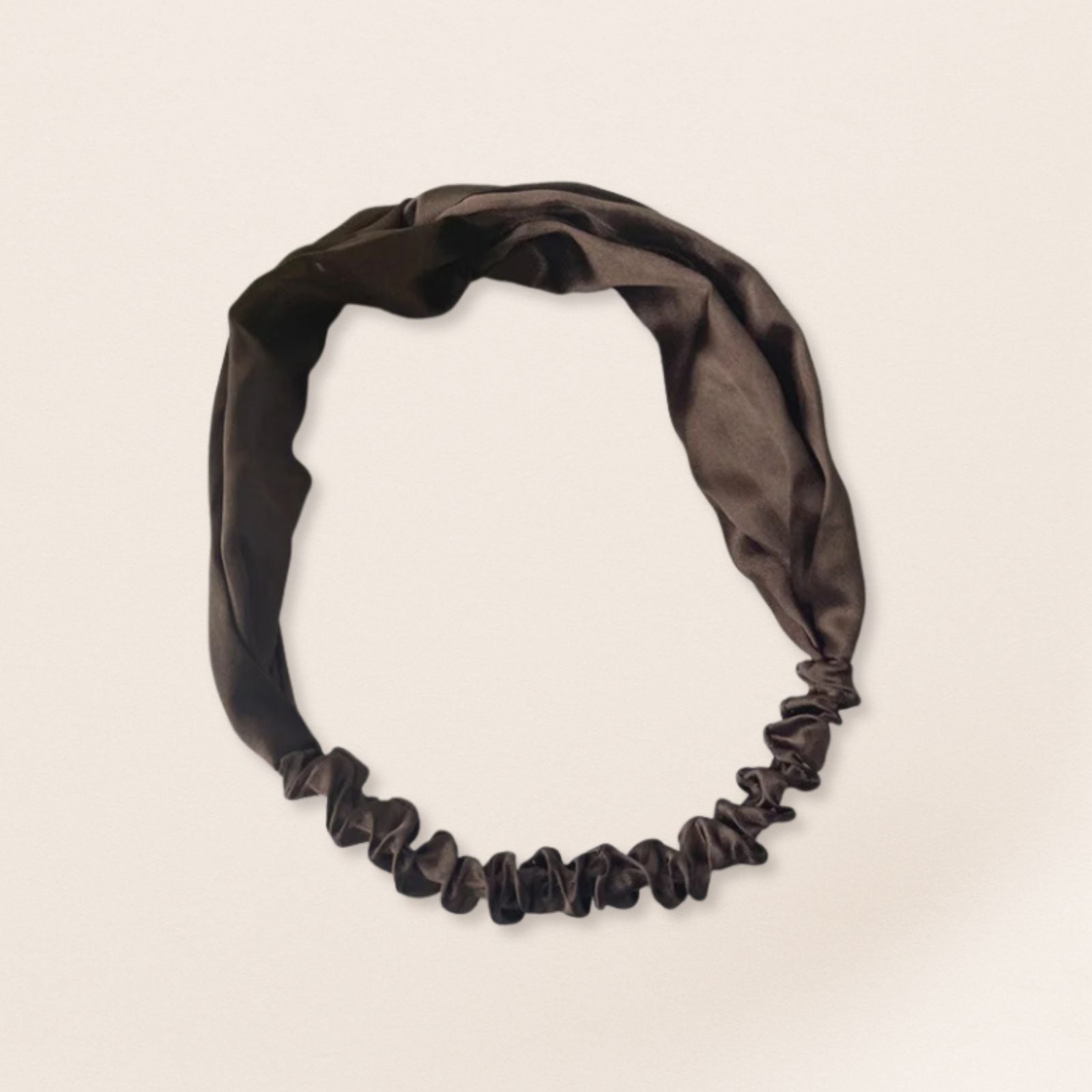 Brown headband on a beige background