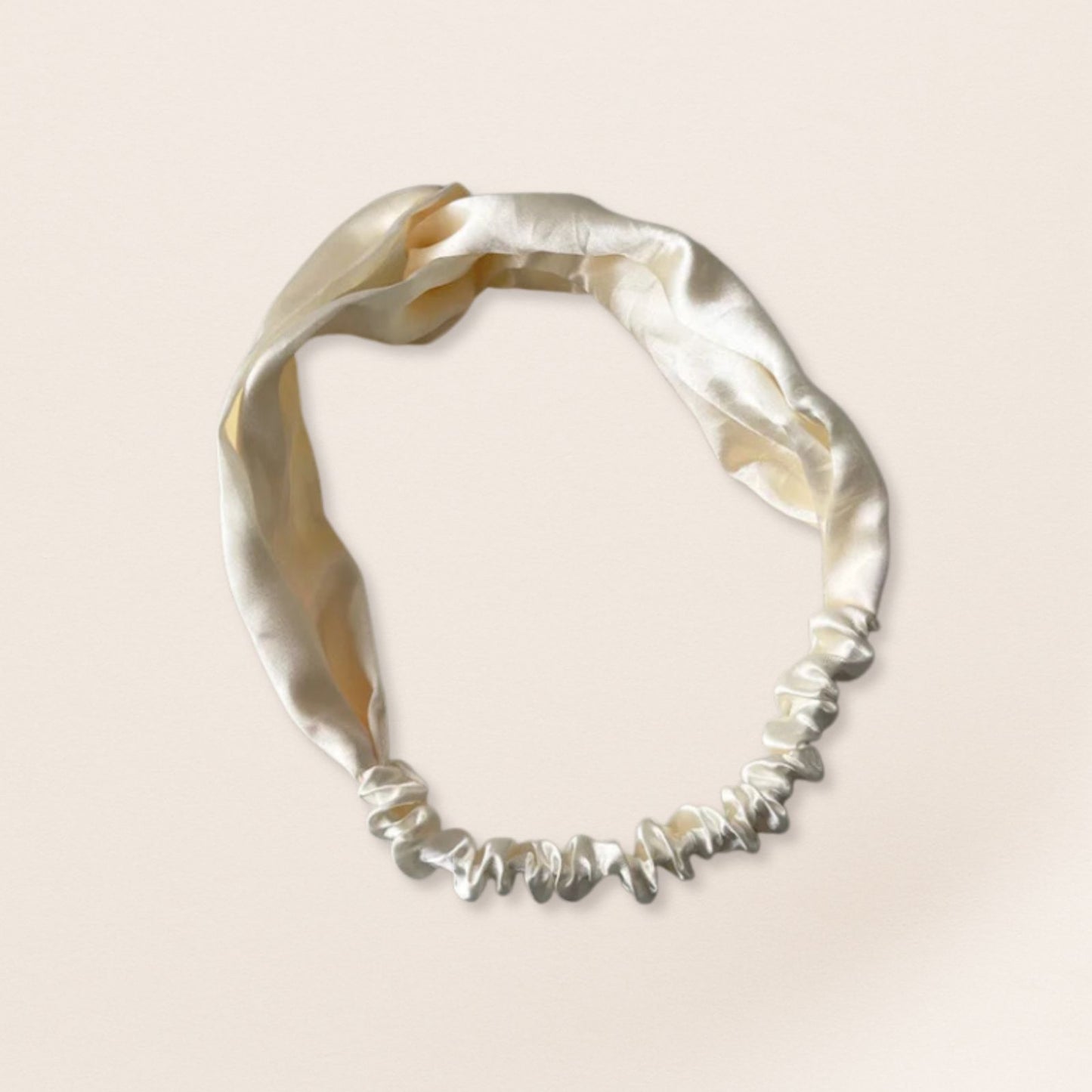 White headband on a beige background